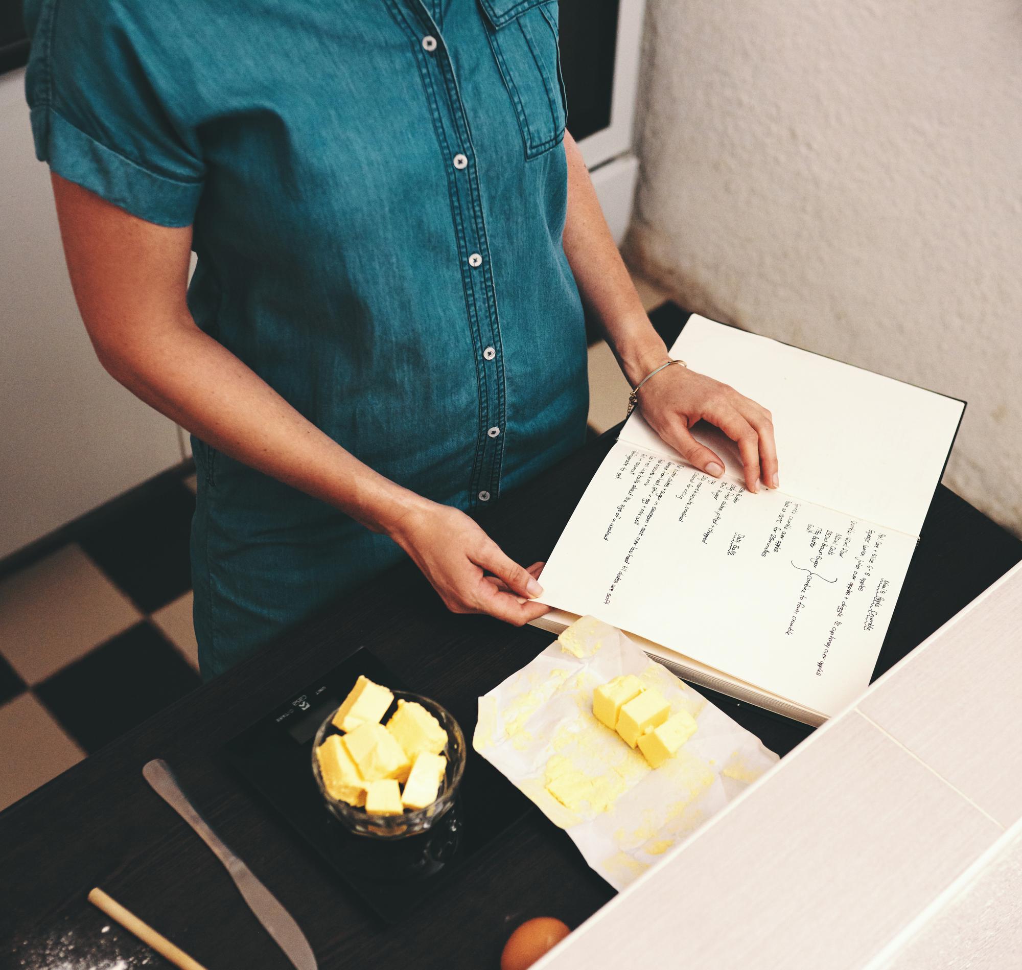 Chef writing menu in rustic kitchen
